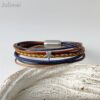Lederarmband mit kleinem Stern in navy cognac