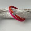 Lederarmband mit Kleeblatt in pink-rot-orange