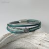 Lederarmband mit einer Lotusblume in Petrol grau