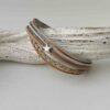 Lederarmband mit einem kleinem Stern in grau und beige