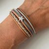 Lederarmband mit kleinem Stern grau beige