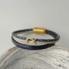 Armband mit Fisch in Gold blau-beige
