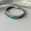 Lederarmband mit Infinity in türkis beige