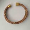 das Lederarmband aus Nappa in Gold und braun