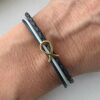 das Armband Fisch Gold schwarz blau